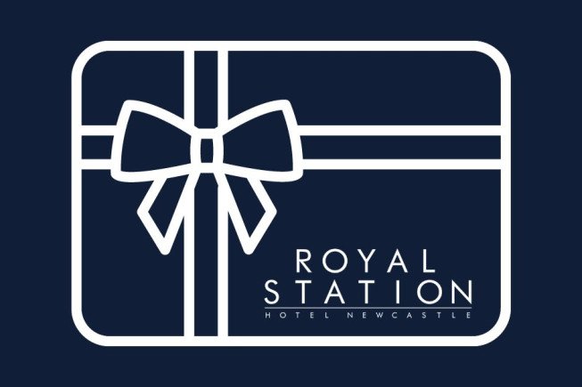 White outlined gift box with a bow and the text "ROYAL STATION HOTEL NEWCASTLE" on a dark navy background.