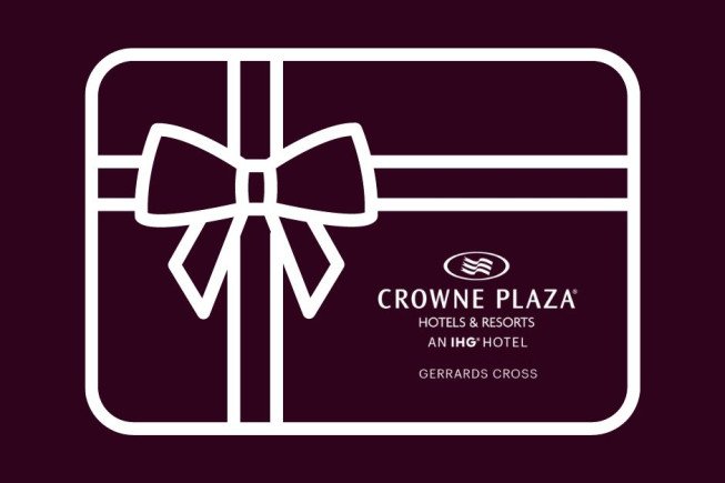 A stylized white gift box with a bow on a dark maroon background, featuring the Crowne Plaza Hotels & Resorts logo and the text "Gerrards C[